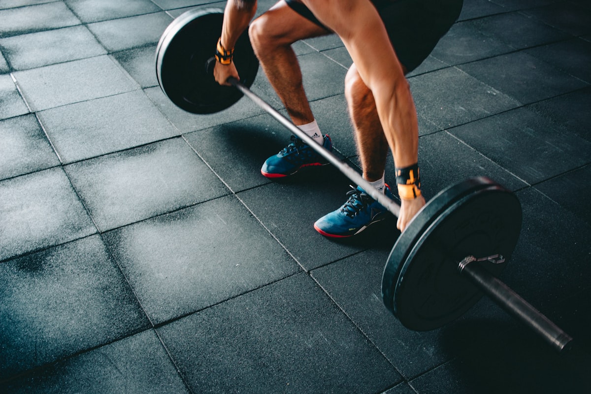 Women training together with weights and proper form